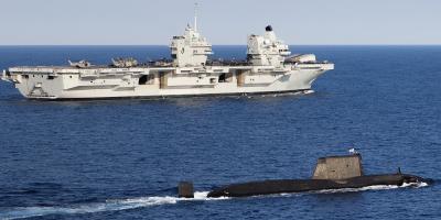 Meeting of the mighty. HMS Queen Elizabeth and her submarine consort